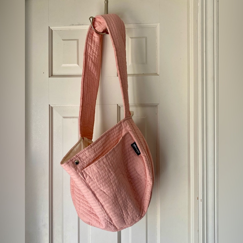 Natuya pink dog sling purse
